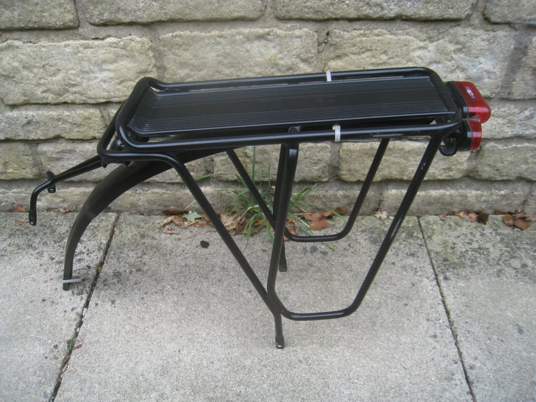 2 pannier racks £10 . tortec / led light 