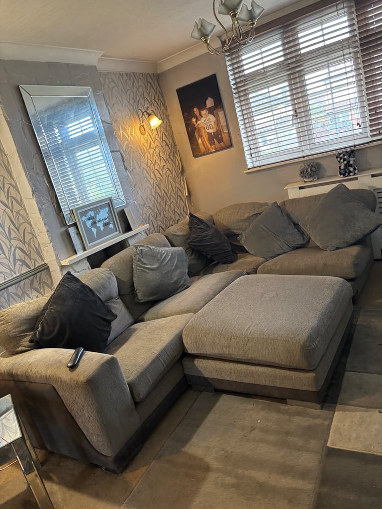 Grey corner sofa. With pillows and footstool 