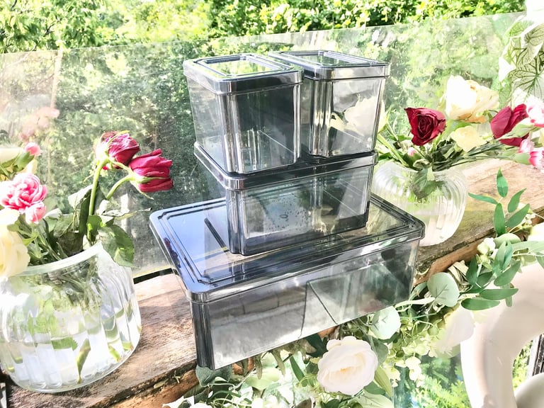 Good quality. Set of 4 Black tint plastic storage boxes Only used a few times