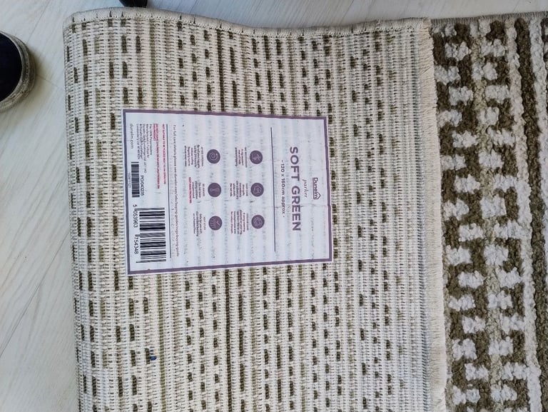 Dunelm rug plus 6 cushions in green colour.