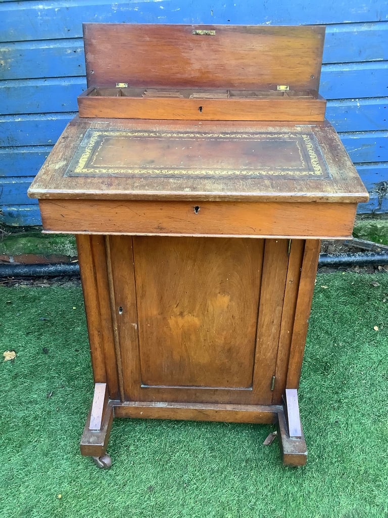 Victorian walnut brown leather insert davenport with ink wells & wheel castors
