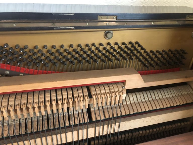 Upright Piano by Stanley Brinsmead London, 7 Octaves, 88 keys, dark wood.  Good condition.