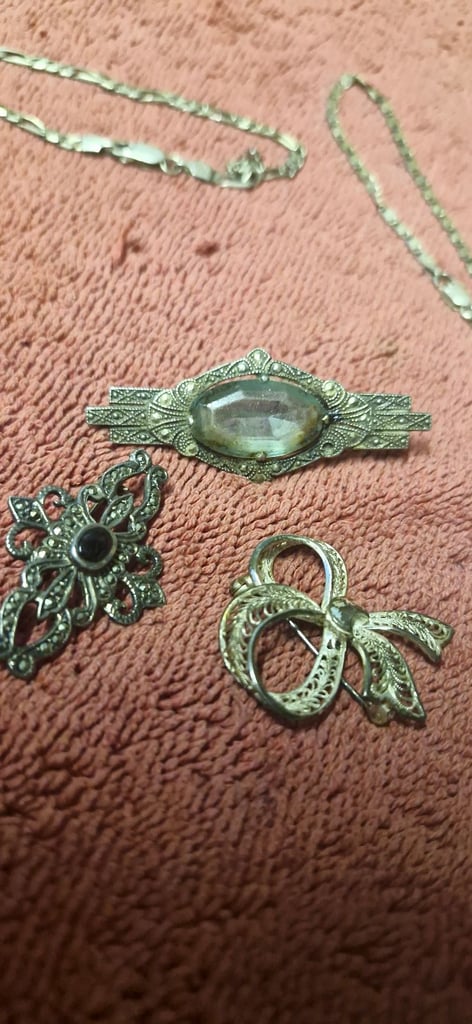 4 silver bracelets and 3 brooches