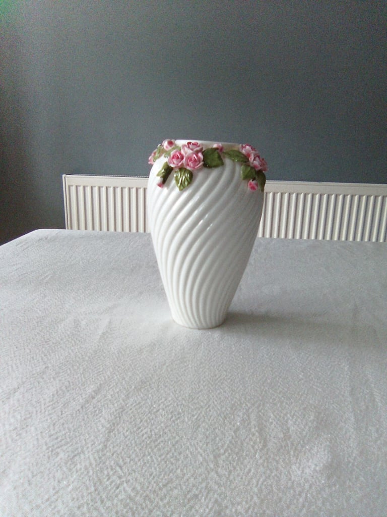 Ornate white ceramic with rose and petal detailing, vase and handled bowl set.