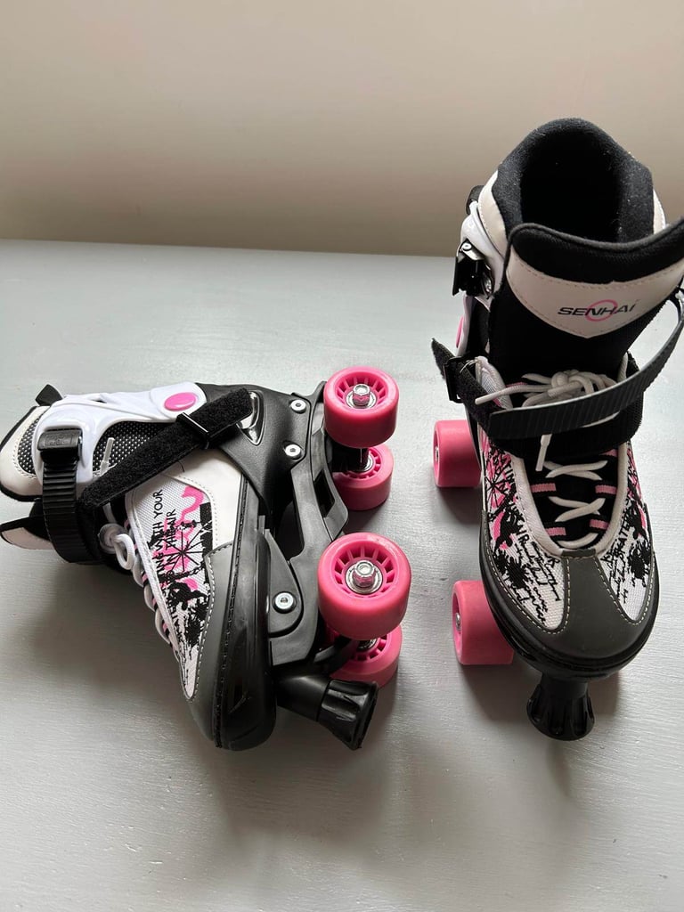 Blindside adjustable quad skates size 4-7 with safety gear.