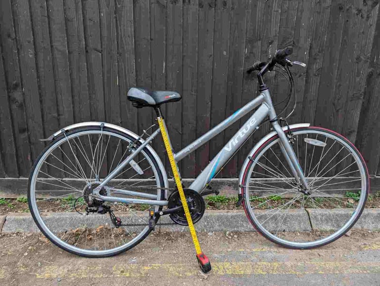Apollo Virtue Hybrid Sport bike in good condition with mudguards and bell.