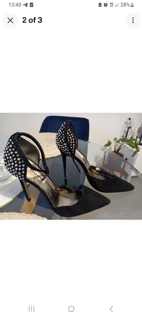 Black heels with coloured stones and matching clutch bag