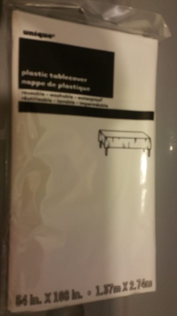 image for Brand new & sealed white plastic table cloths, 54 inches x 104 inches