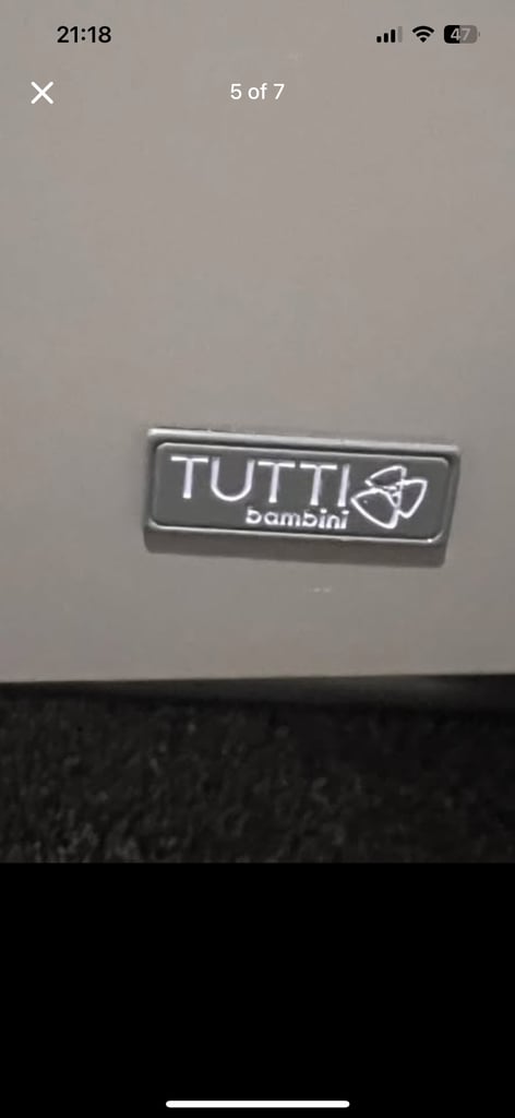 Grey cot bed with mattress available 