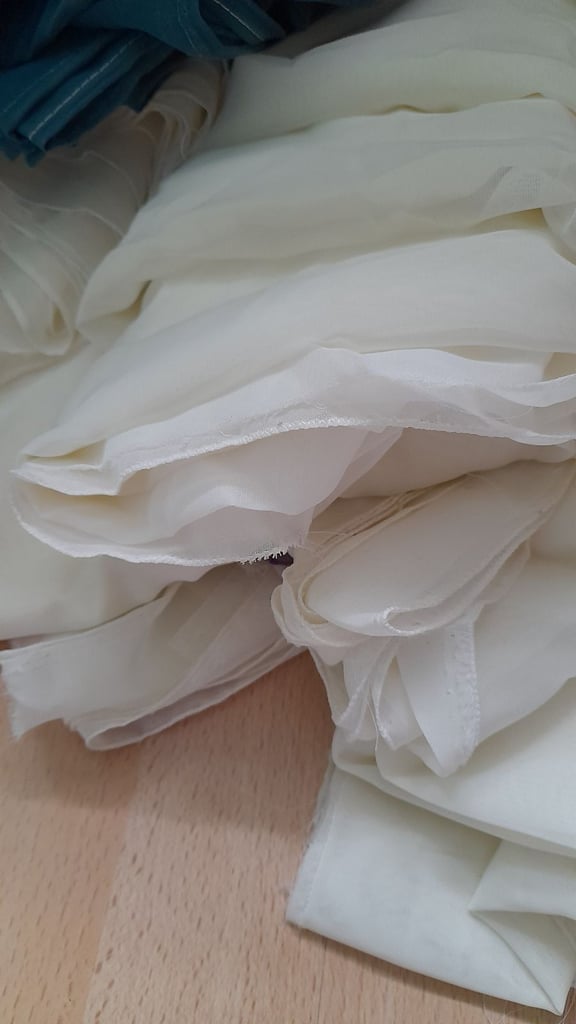 Large quantity of voile cream, teal and plum