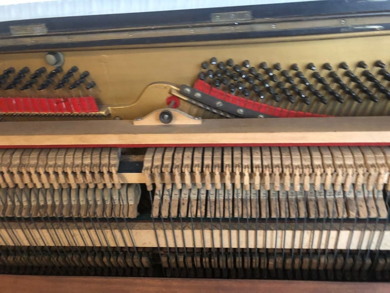 Upright Piano by Stanley Brinsmead London, 7 Octaves, 88 keys, dark wood.  Good condition.