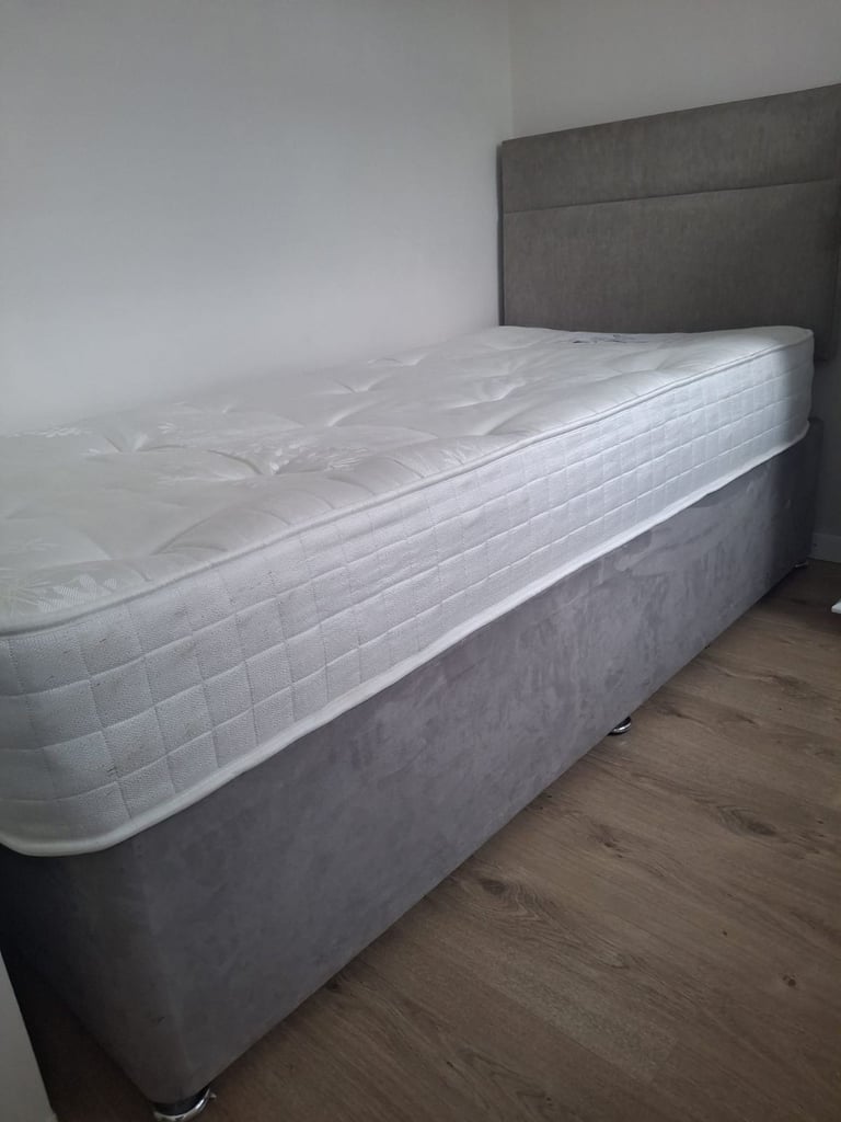Single bed with mattress and headboard
