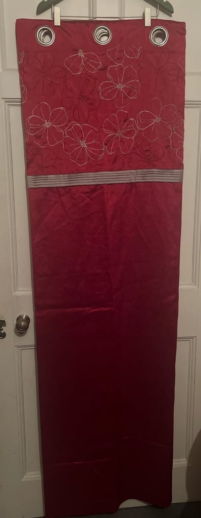 image for A pair of curtains, red in colour with floral design 