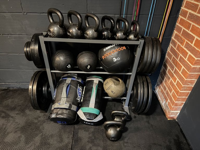 image for Kettle bells, slam balls, slam bags and medicine ball plus storage rack (plates not included)