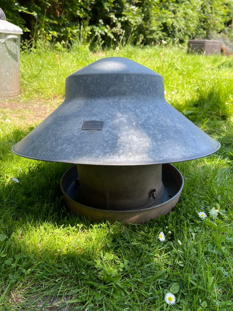 Outdoor poultry feeder with rain hood. Galvanised. 