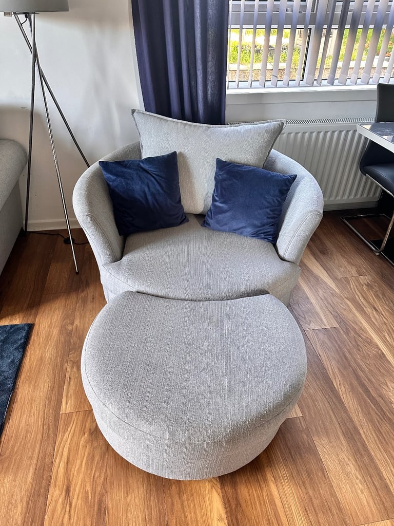 DFS Owen swivel chair & half moon footstool.
