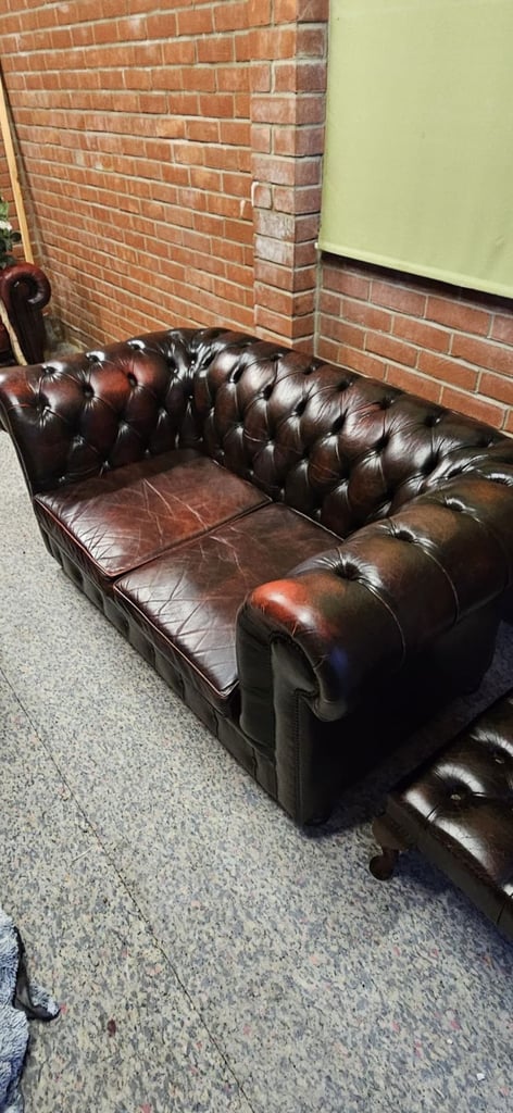 image for Beautiful vintage 2 seater chesterfield sofa with matching footstool.