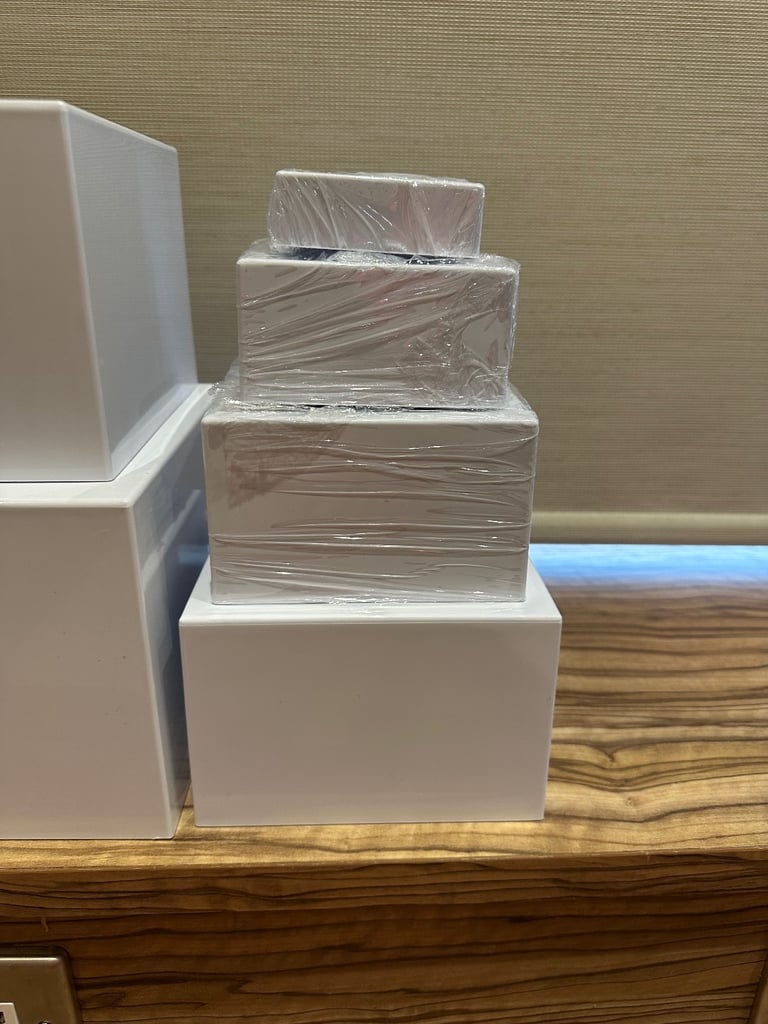 6 white acrylic buffet risers / display stands 