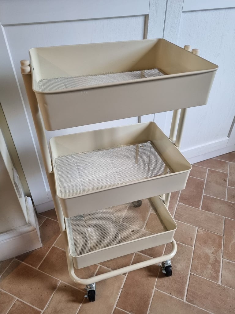 Three tier cream storage unit on wheels