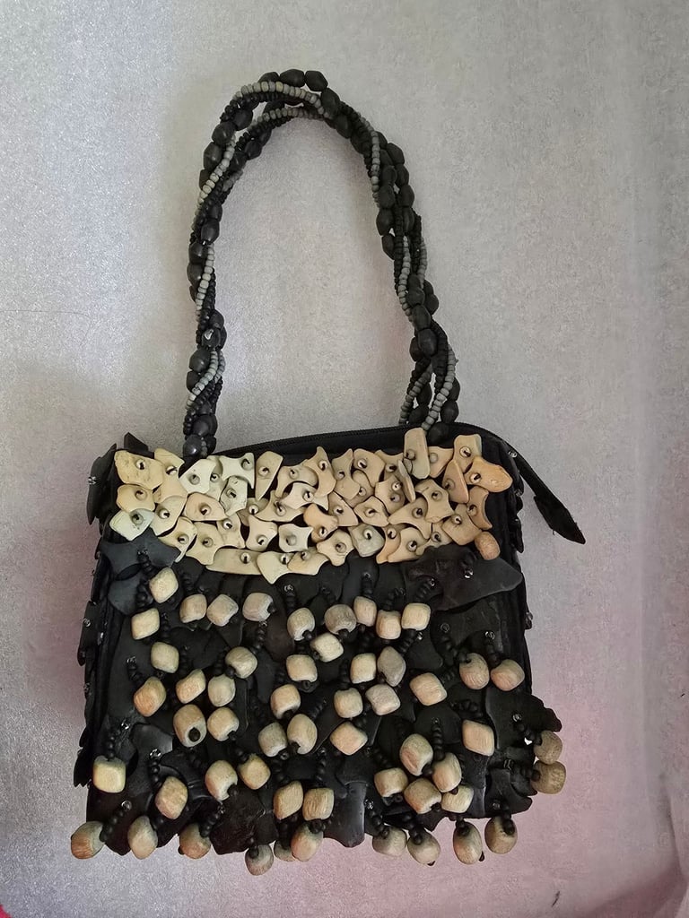 image for PELE Coconut shell handbag bag. unusual bag, Zip opening. The bead detail makes lovely sound