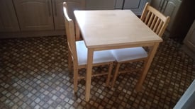 Beech wooden kitchen table and two matching chairs