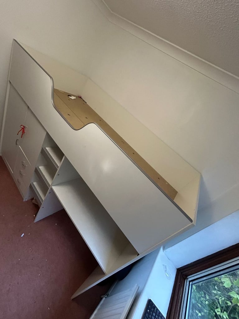 Cabin bed with built-in wardrobe and workstation. 