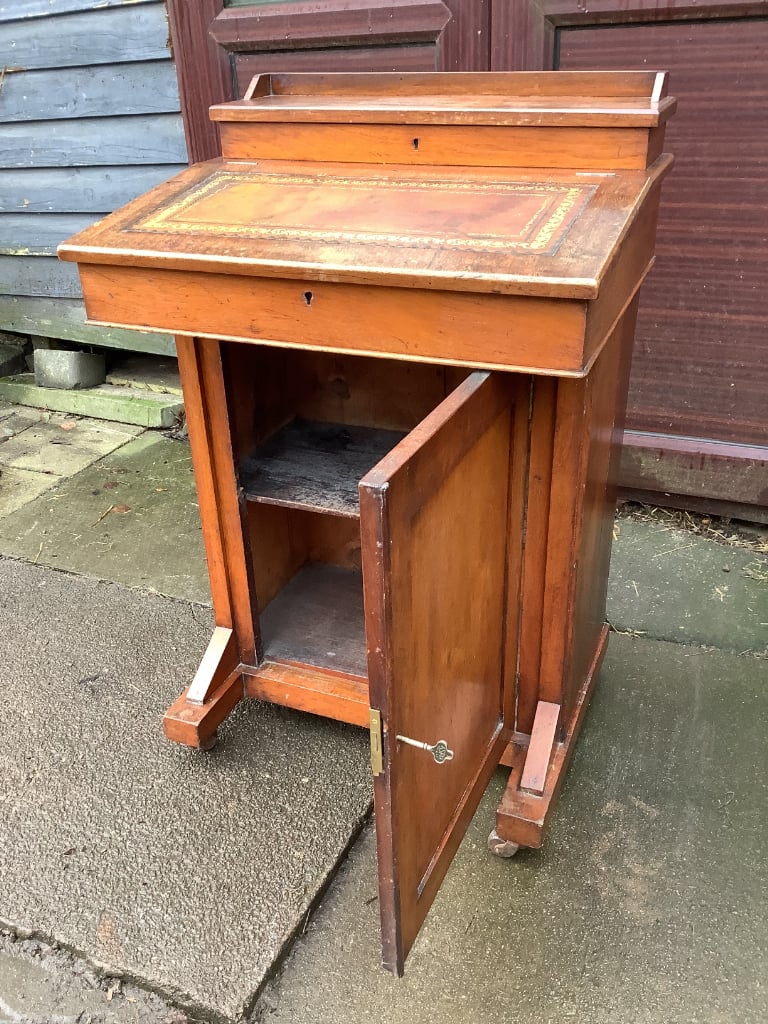 Victorian walnut brown leather insert davenport with ink wells & wheel castors