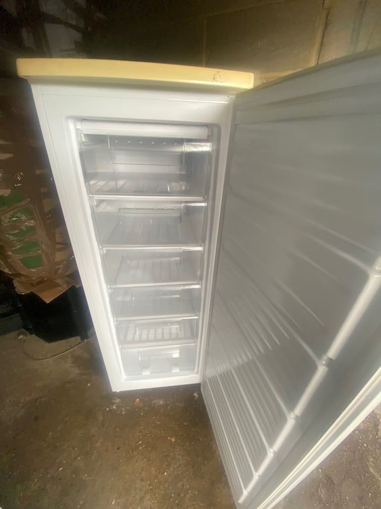 image for Upright freezer 21x21x56 from a garage wear and tear 