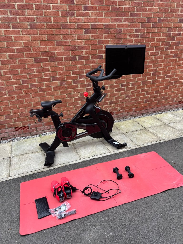 image for Peloton + bike with accessories, dumbells and cleats
