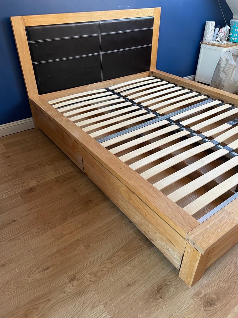 Oak King Size Wooden bed frame with four underbed wheeled drawers 
