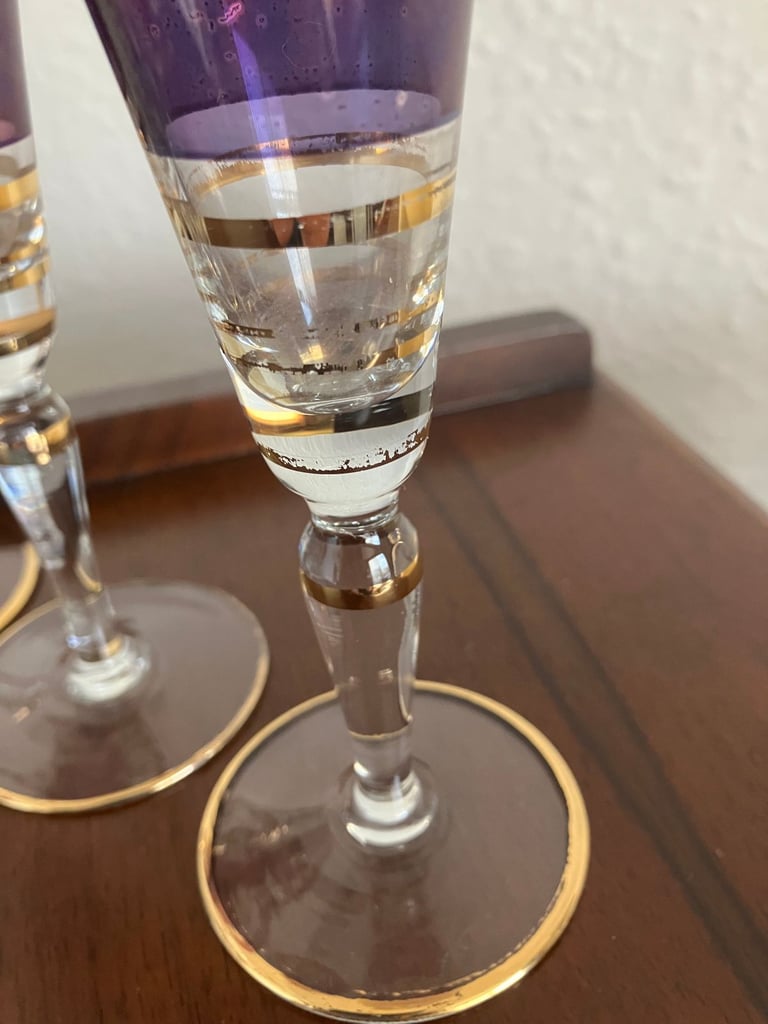 Heavy glass decanter and six vintage wine glasses.