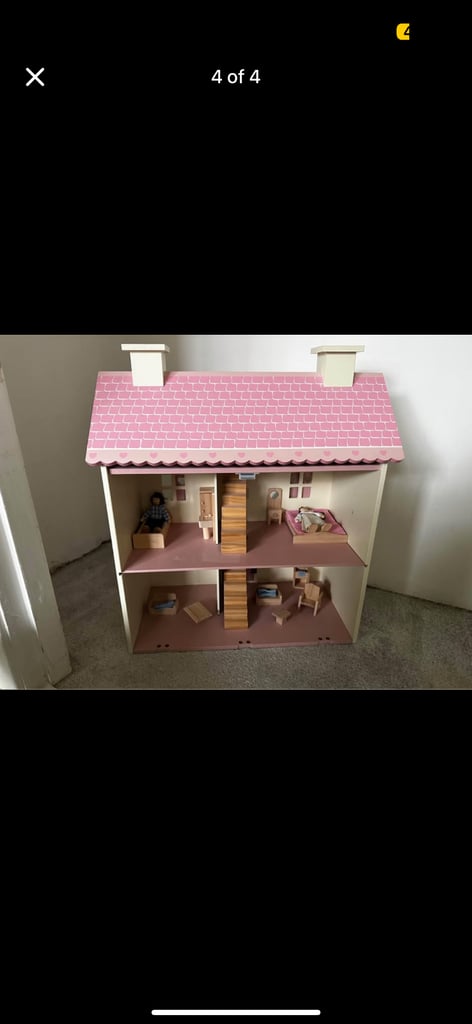 Girl pink dolls house with furnishings 
