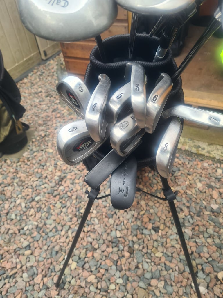 Full set of golf clubs.