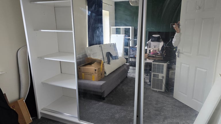 Spacious wardrobe with sliding doors