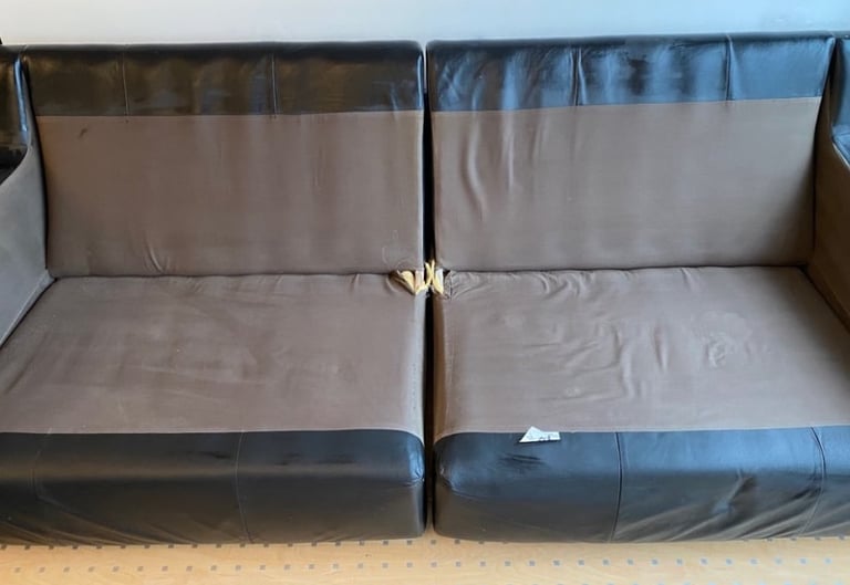 A faux leather sofa in the colour black