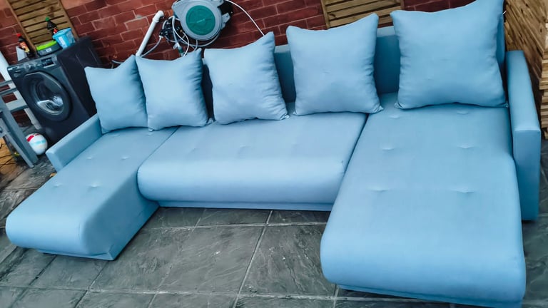 Light blue huge corner sofa bed with storge 