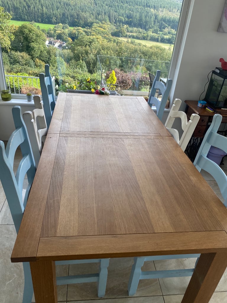 image for Sold oak 6-8 seater table and chairs -extendable 