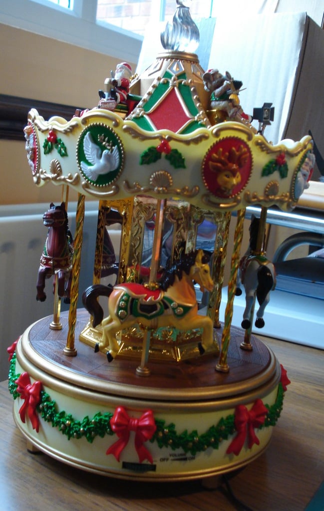 CHRISTMAS HOLIDAY MERRY GO ROUND IN FULL WORKING ORDER