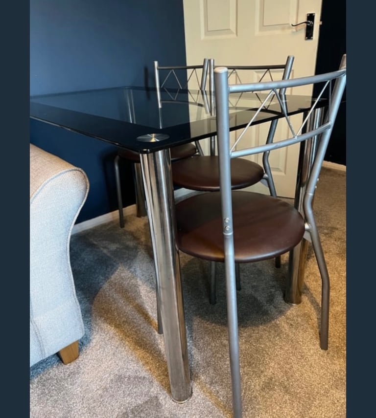 image for Glass and chrome dinning table and chairs used 
