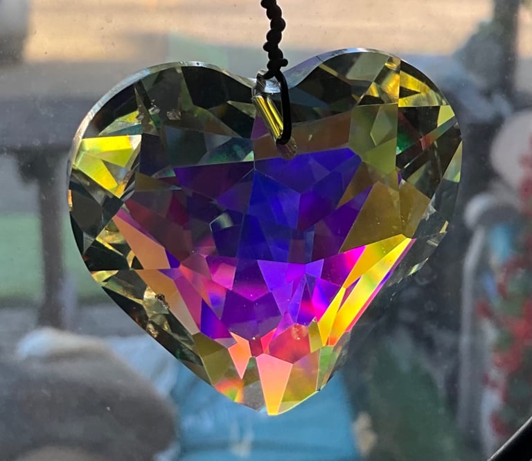 STUNNING CHRISTAL HEART. Prisms reflect the light and colours. Difference places different colours 