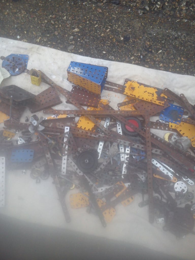 Vintage meccano pieces and literature.