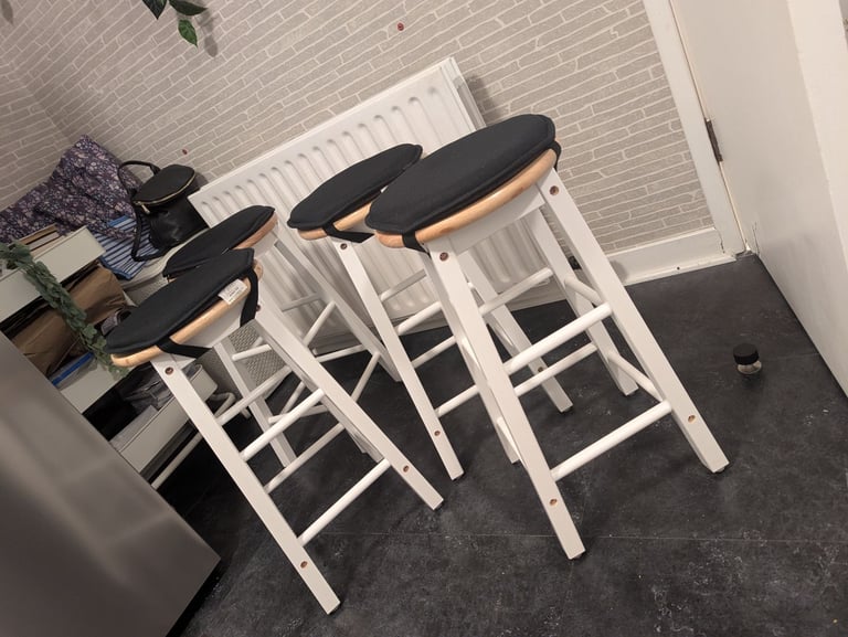 Habitat 4 as new wooden stools with clip of seatpads 
