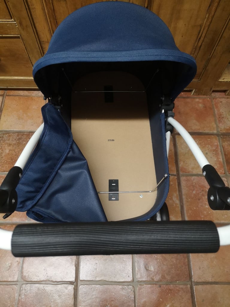 Brio Spin luxury toy pram for dolls & soft toys. Navy blue. Adjustable handle. Great used condition.