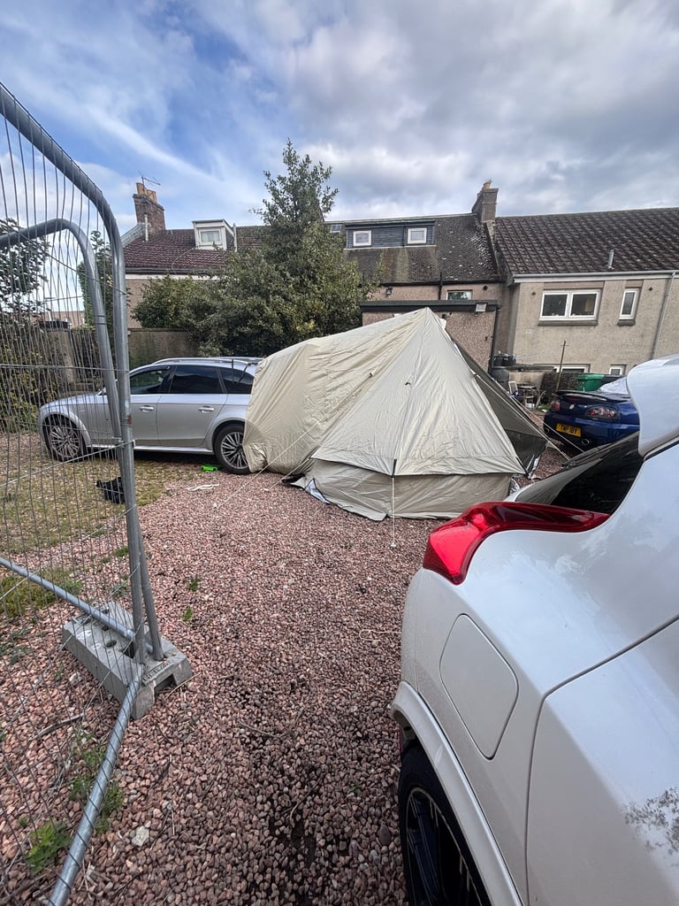 Car bell tent with log burner 
