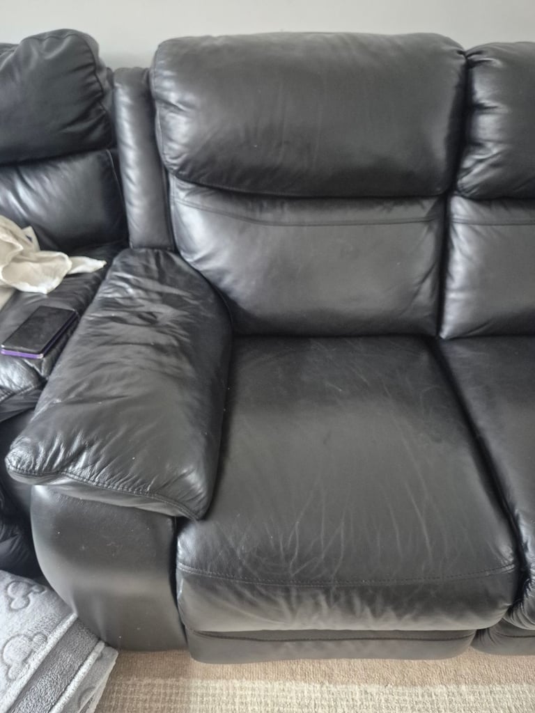 Two seater leather reclining sofa