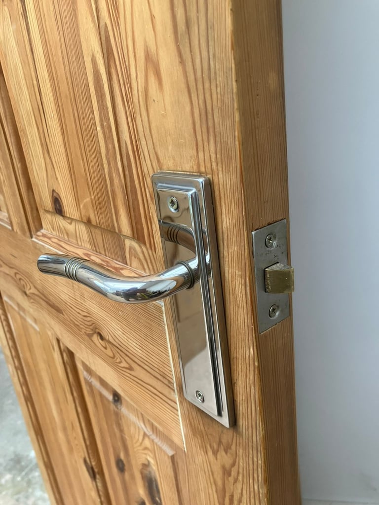 solid pine 4 panel door with silver coloured handle 