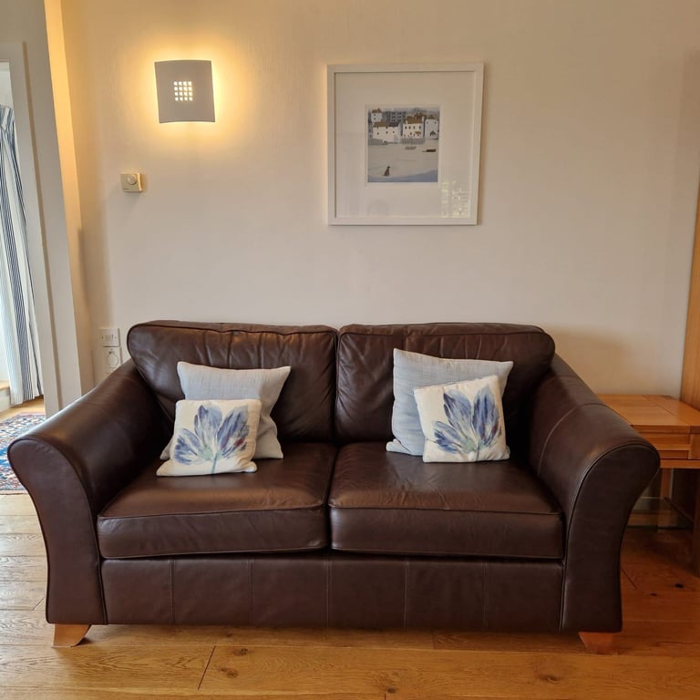 Two Marks and Spencers Abbey brown leather sofas