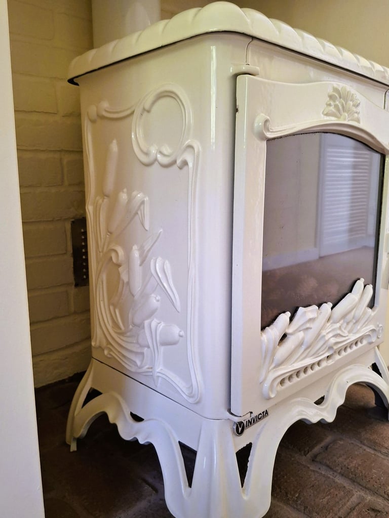 Ivory enamel Invicta French woodburner fire. 