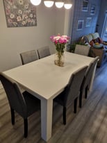 Extendable white gloss dining table and 8 chairs