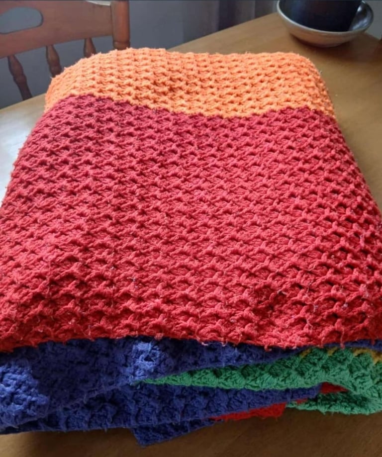 Crocheted king-size.  Rainbow colours Striped blanket